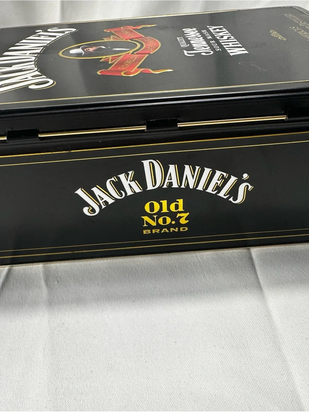 T542. Jack Daniel's Tennessee Whiskey Tin - Black with Red & Gold Accents